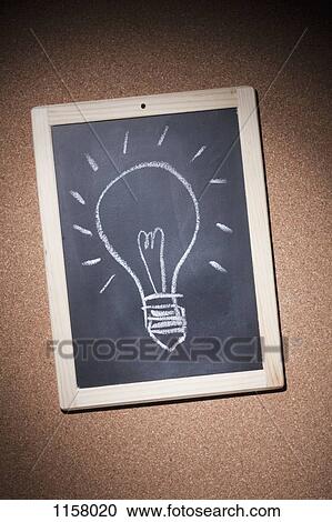 Stock Image - An illuminated light bulb drawn in chalk on a small chalkboard. Fotosearch