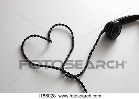 An old-fashioned telephone cord arranged into the shape of a heart View Large Photo Image Stock Photo - An old-fashioned telephone cord arranged into the shape of a heart. Fotosearch