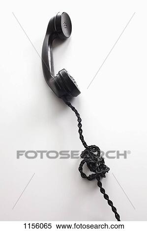 Stock Photography - An old-fashioned telephone cord tangled in a knot. Fotosearch