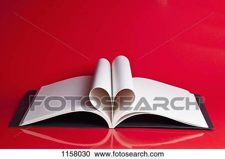 An open hardcover book with pages folded to look like a heart View Large Photo Image Stock Image - An open hardcover book with pages folded to look like a heart. Fotosearch