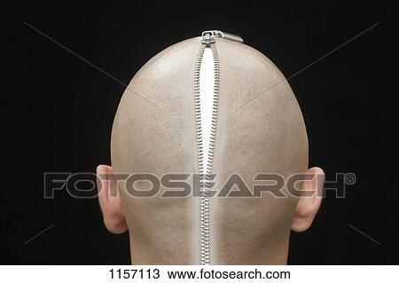 Stock Image - An open zip on the head of a man, rear view. Fotosearch