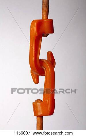 An orange hook attached to a rope pulling another hook attached to a rope View Large Photo Image Stock Photo - An orange hook attached to a rope pulling another hook attached to a rope. Fotosearch