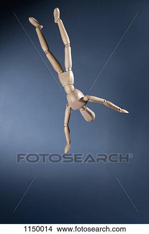 An upside down artist's figure falling in mid-air View Large Photo Image Picture - An upside down artist's figure falling in mid-air. Fotosearch