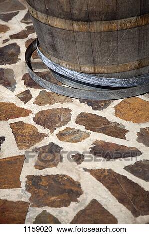 Barrel on paving stone floor View Large Photo Image Stock Image - Barrel on paving stone floor. Fotosearch