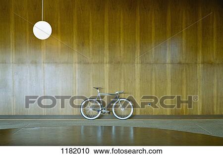 Bike parked against wood paneling View Large Photo Image Stock Image - Bike parked against wood paneling . Fotosearch