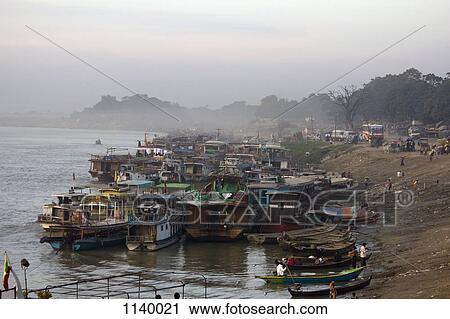 Boats moored on the river bank, Ayeyarwady River, Mandalay, Burma View Large Photo Image Stock Image - Boats moored on the river bank, Ayeyarwady River, Mandalay, Burma. Fotosearch