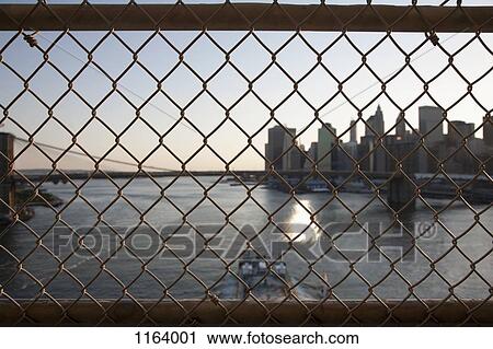 Stock Image - Bridge wire mesh fence. Fotosearch