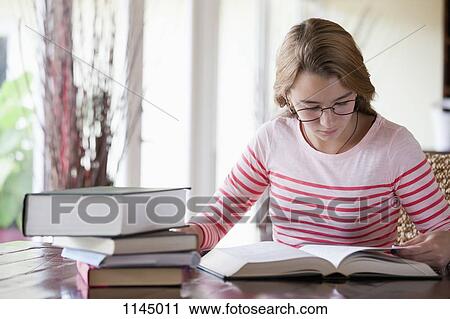Busy girl doing homework View Large Photo Image Stock Image - Busy girl doing homework. Fotosearch