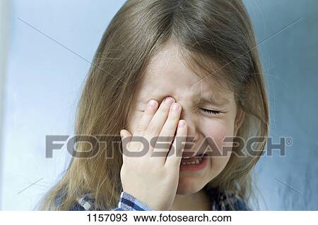Stock Image - Close-up of a young girl crying. Fotosearch