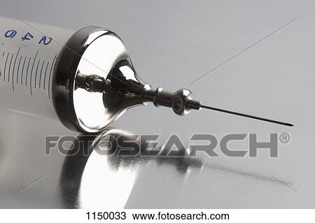 Close-up of metal and plastic syringe View Large Photo Image Stock Image - Close-up of metal and plastic syringe. Fotosearch