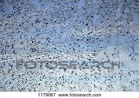 Stock Photo - Cobweb pattern of cracked glass. Fotosearch