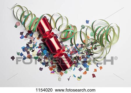 Confetti, streamers and a Christmas cracker View Large Photo Image Stock Image - Confetti, streamers and a Christmas cracker. Fotosearch