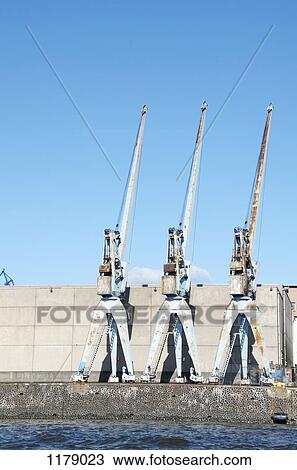 Cranes in industrial port of Hamburg View Large Photo Image Stock Image - Cranes in industrial port of Hamburg. Fotosearch