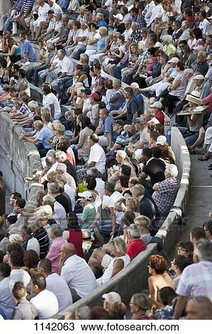 Stock Image - Detail of a crowd in a sports arena. Fotosearch