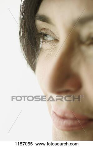 Detail of a mature woman looking away View Large Photo Image Stock Photography - Detail of a mature woman looking away. Fotosearch