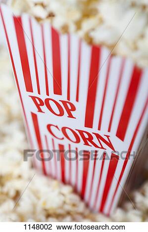 Detail of a red striped popcorn carton with Popcorn printed on it View Large Photo Image Stock Image - Detail of a red striped popcorn carton with Popcorn printed on it. Fotosearch