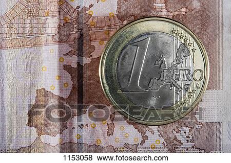 Detail of a ten Euro banknote with a one Euro coin on top of it View Large Photo Image Stock Photo - Detail of a ten Euro banknote with a one Euro coin on top of it. Fotosearch