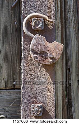 Detail of an open padlock hanging on a bolt View Large Photo Image Stock Photograph - Detail of an open padlock hanging on a bolt. Fotosearch