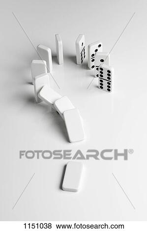 Dominoes arranged in a question mark falling over in a chain reaction View Large Photo Image Stock Photo - Dominoes arranged in a question mark falling over in a chain reaction. Fotosearch