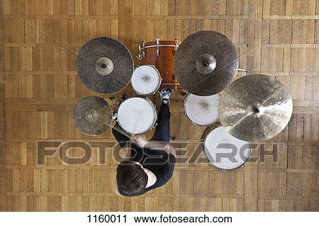 Stock Image - Drummer plays kit. Fotosearch