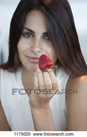 Elegant woman offering strawberry View Large Photo Image Stock Photography - Elegant woman offering strawberry. Fotosearch