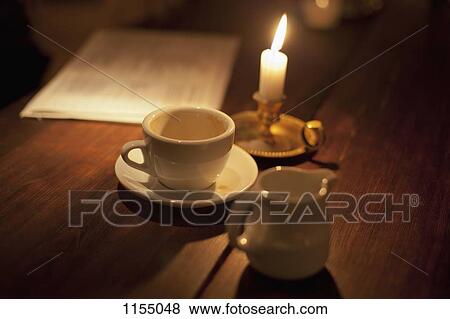 Empty cup of coffee by the candle light View Large Photo Image Stock Photo - Empty cup of coffee by the candle light. Fotosearch