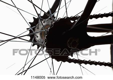 Stock Photography - Extreme close up of chain and spokes . Fotosearch