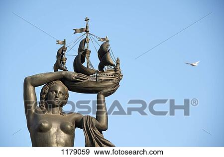 Female Statue carrying ship View Large Photo Image Stock Photo - Female Statue carrying ship. Fotosearch
