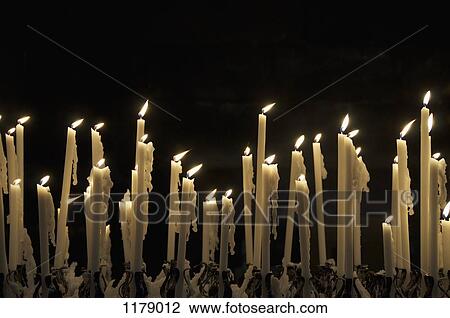 Flickering flames of candles View Large Photo Image Stock Image - Flickering flames of candles. Fotosearch