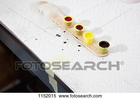 Four ink cup holders in a row on a tongue depressor with a dab of petroleum jelly View Large Photo Image Stock Photography - Four ink cup holders in a row on a tongue depressor with a dab of petroleum jelly. Fotosearch