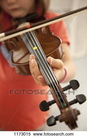 Stock Photography - Girl playing violin. Fotosearch