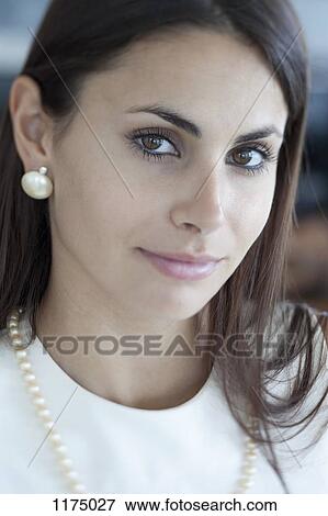 Stock Photo - Glamorous woman with reflection in her eyes. Fotosearch