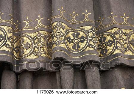 Golden detail of garment on clerical statue of Saint Ansgar View Large Photo Image Stock Photograph - Golden detail of garment on clerical statue of Saint Ansgar. Fotosearch