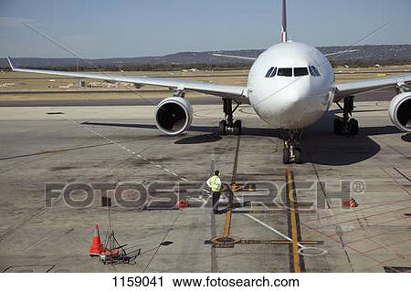 Ground crew and jet on runway View Large Photo Image Stock Image - Ground crew and jet on runway. Fotosearch