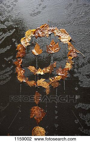 Stock Image - Happy dead maple leaves. Fotosearch