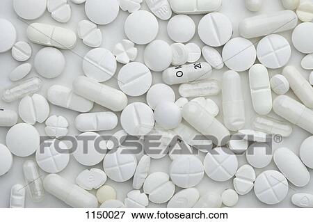 Heap of various white pills and capsules, close-up View Large Photo Image Stock Photo - Heap of various white pills and capsules, close-up. Fotosearch
