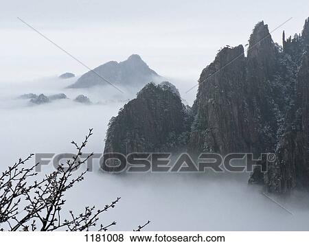 Huangshan Mountains surrounded by mist, Anhui, China View Large Photo Image Stock Photo - Huangshan Mountains surrounded by mist, Anhui, China. Fotosearch