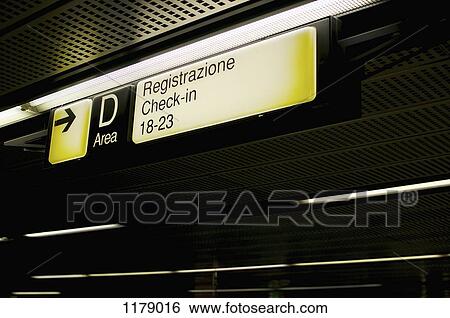 Stock Photograph - Italian check-in sign at airport. Fotosearch
