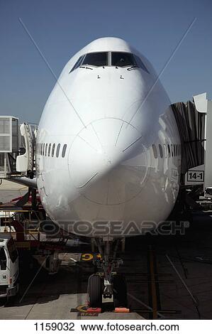 Jumbo jet attached to boarding bridge View Large Photo Image Stock Image - Jumbo jet attached to boarding bridge. Fotosearch