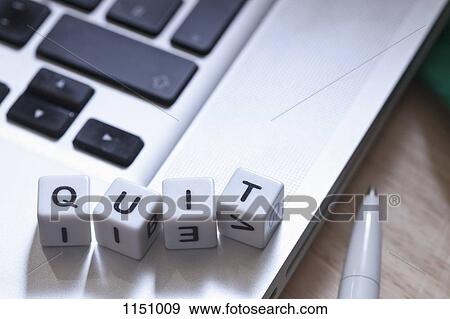 Lettered cubes on a laptop spelling QUIT View Large Photo Image Stock Photo - Lettered cubes on a laptop spelling QUIT. Fotosearch