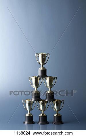 Loving cup trophies stacked in a pyramid View Large Photo Image Picture - Loving cup trophies stacked in a pyramid. Fotosearch