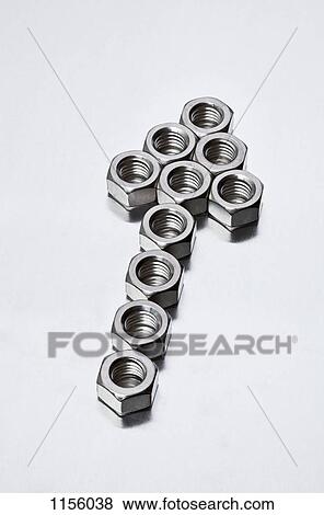 Metal nuts arranged in the shape of an arrow sign View Large Photo Image Stock Photo - Metal nuts arranged in the shape of an arrow sign. Fotosearch