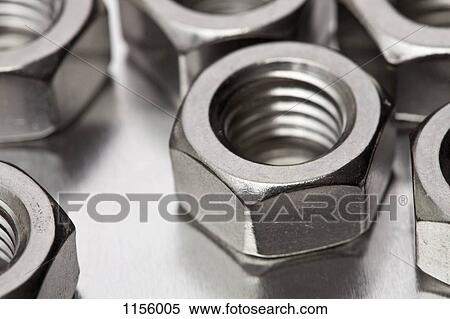 Stock Photography - Metal nuts, close-up. Fotosearch
