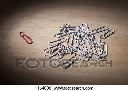 One red paperclip set apart from a heap of white paperclips View Large Photo Image Stock Photo - One red paperclip set apart from a heap of white paperclips. Fotosearch