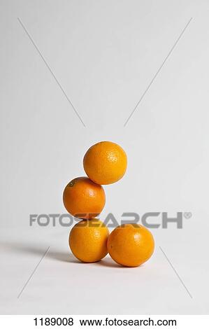 Oranges stacked precariously, studio shot View Large Photo Image Stock Photo - Oranges stacked precariously, studio shot. Fotosearch