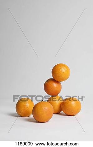 Oranges stacked precariously, studio shot View Large Photo Image Stock Photo - Oranges stacked precariously, studio shot. Fotosearch