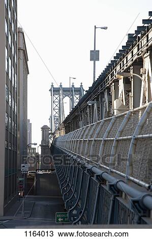 Outer barrier of Manhattan Bridge with road below View Large Photo Image Stock Image - Outer barrier of Manhattan Bridge with road below. Fotosearch