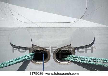 Outlets for ropes on a moored boat View Large Photo Image Stock Photograph - Outlets for ropes on a moored boat. Fotosearch