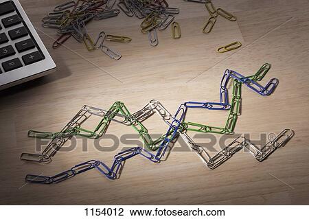 Paperclips arranged to look like lines on a line graph View Large Photo Image Stock Image - Paperclips arranged to look like lines on a line graph. Fotosearch