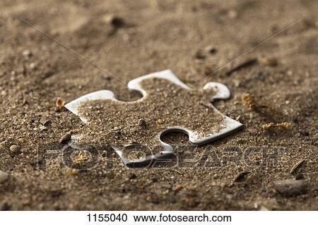 Piece of jigsaw in the dirt View Large Photo Image Stock Image - Piece of jigsaw in the dirt. Fotosearch
